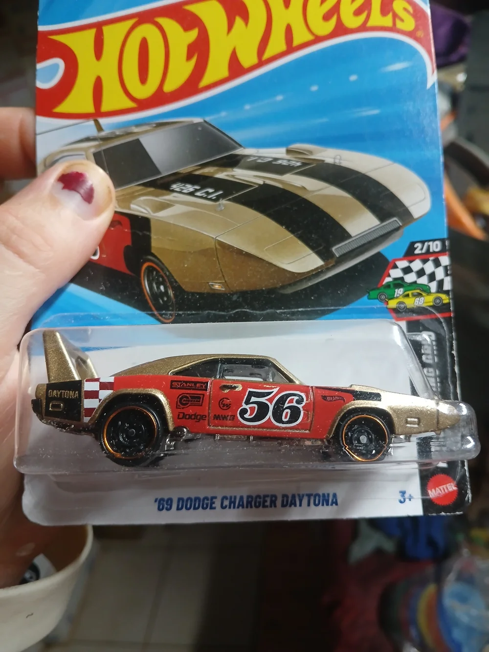 the Hot Wheels '69 Dodge Charger Daytona in metalflake gold from the 2026
